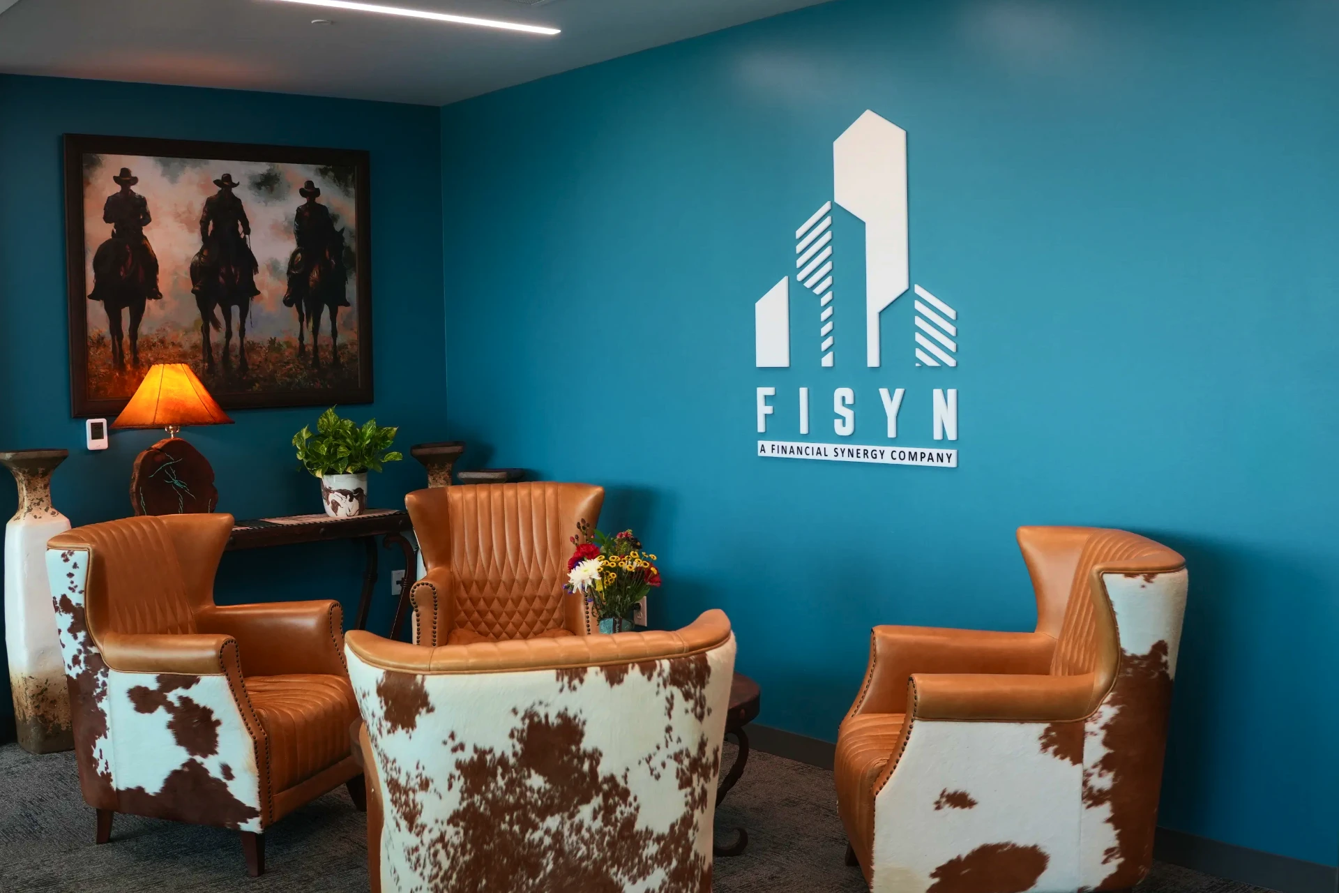 FISYN office lounge with branded wall